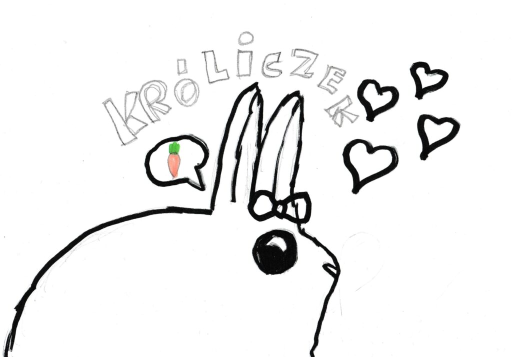 Kolorowanka przedstawiająca króliczka z serduszkami i marchewką.